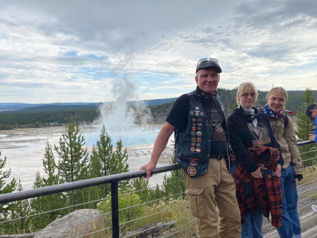 Some people standing by the Grand Prismatic Spring.