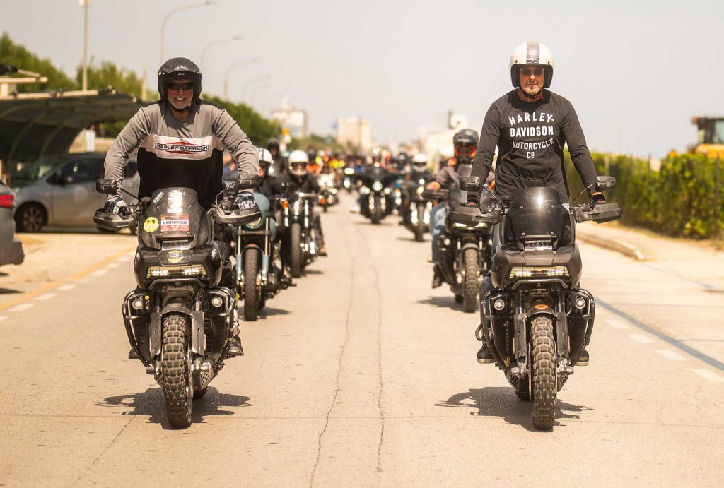 Motorcycle parade with two riders on the Pan America at the front