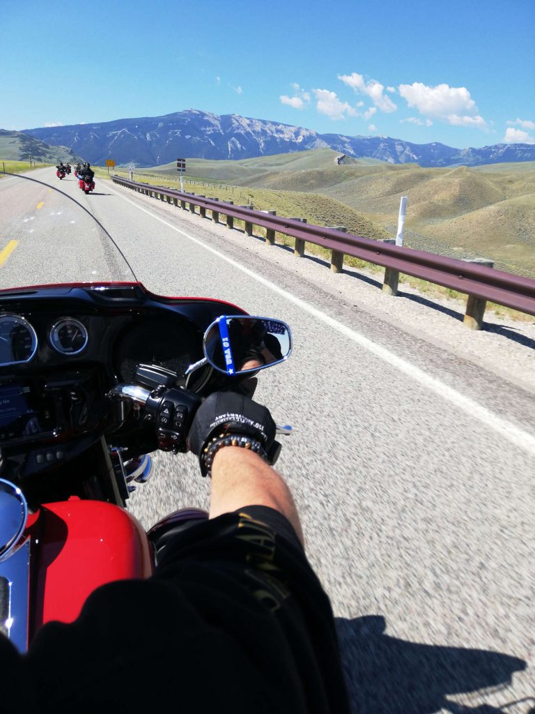 A Harley-Davidson on a scenic road.