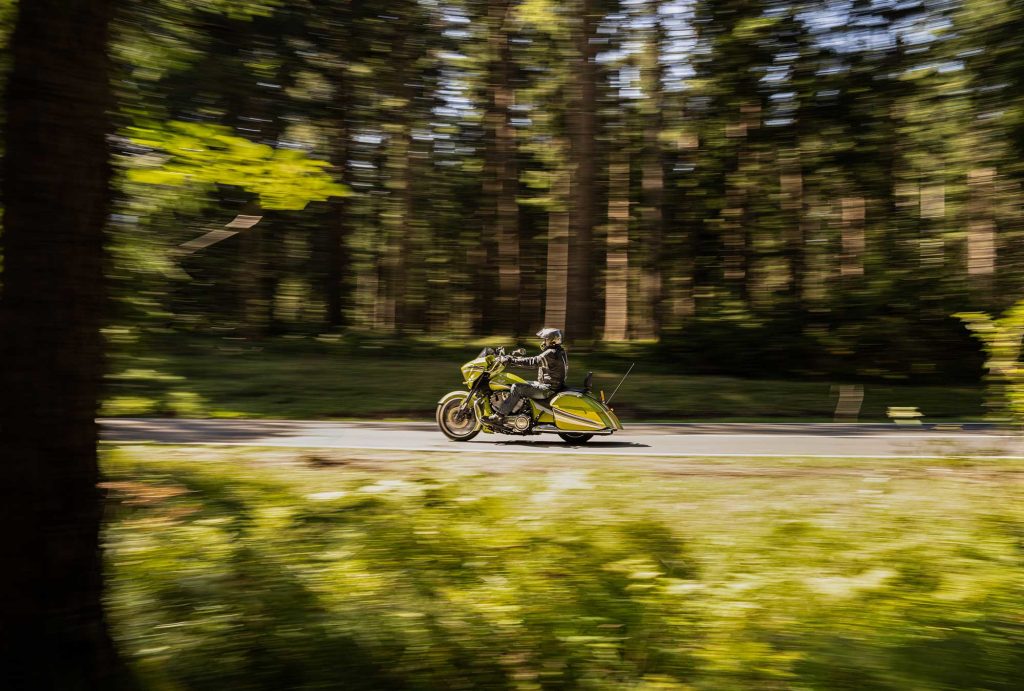 H-D rider on a ride through the woods