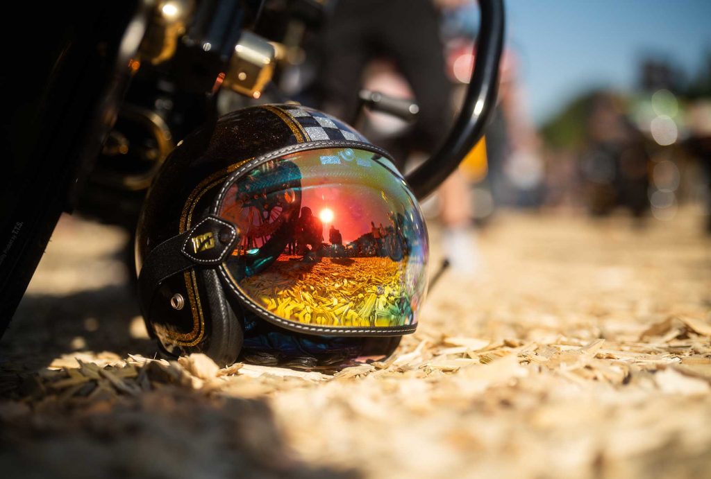 Crash helmet on the ground with mirrored visor