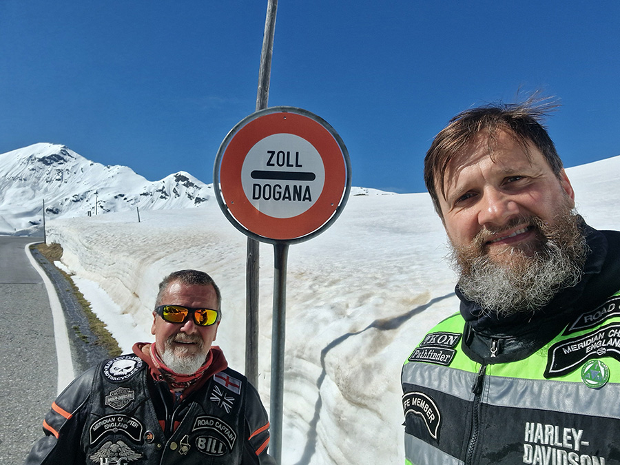 Two HOG members up in the mountains surrounded by snow