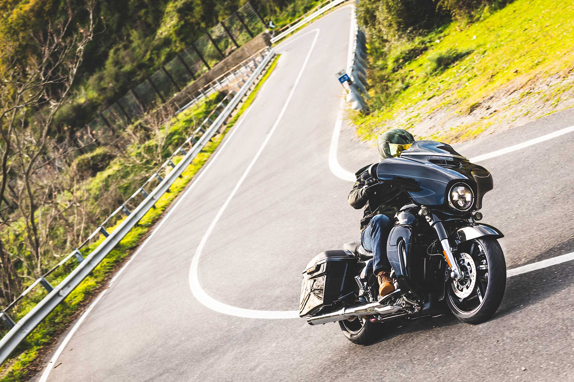 Biker riding a Harley-Davidson on the road