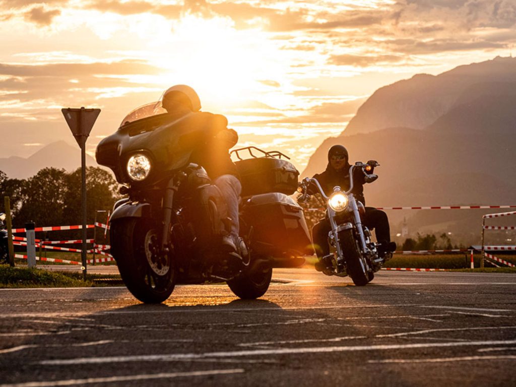 People riding some Harley-Davidson bikes.