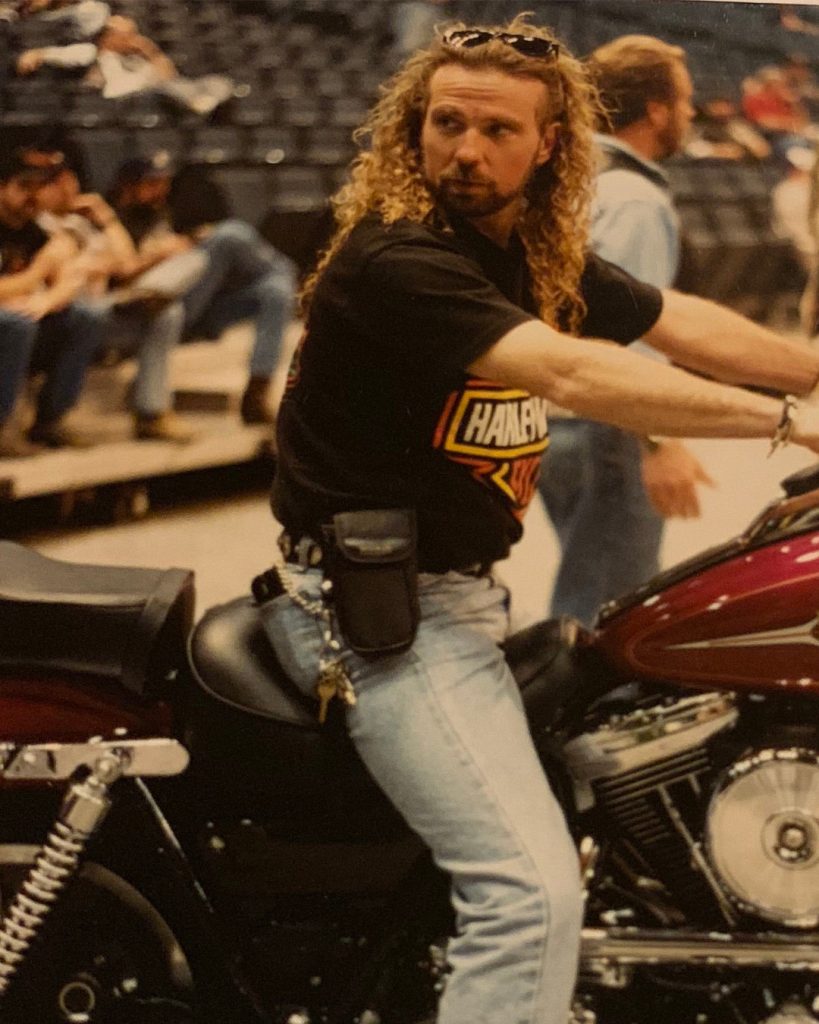 Young Perry Givens on motorcycle