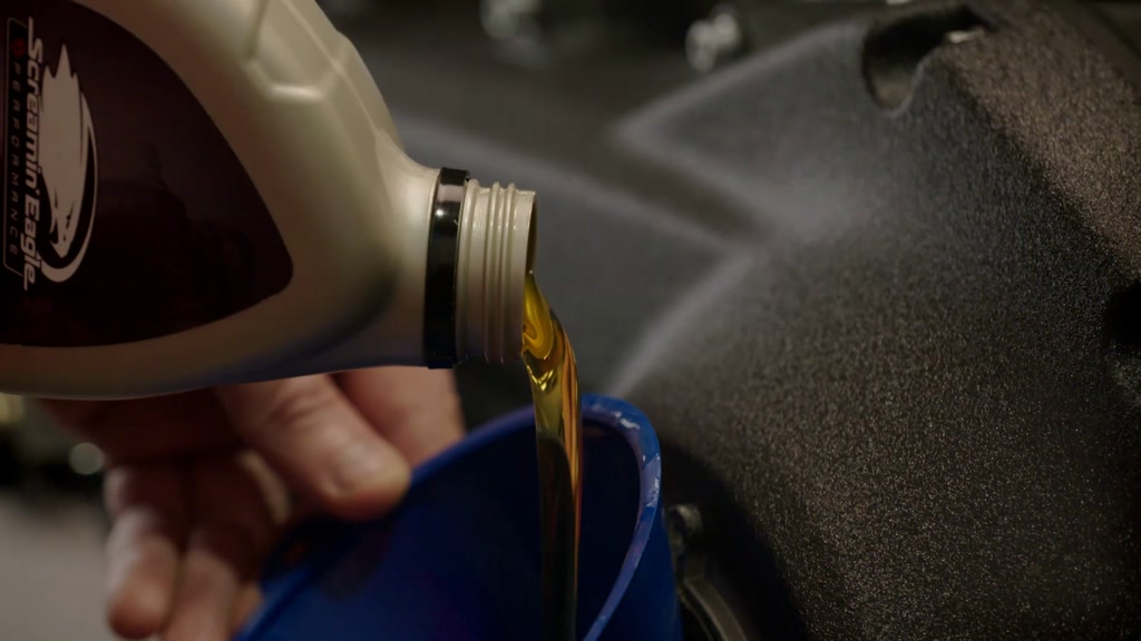 Oil being added to motorcycle