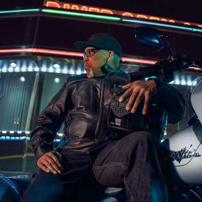 Someone sat outside with a bike